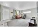 Bright living room with tile entryway, neutral walls, and comfortable seating at 7861 Osceola St, Westminster, CO 80030