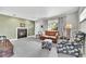 Comfortable living room featuring a fireplace, hardwood floors, and cozy seating at 7861 Osceola St, Westminster, CO 80030