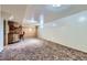 Finished basement features a retro bar, carpeted floor, and ample space at 10731 Rosalie Dr, Northglenn, CO 80233