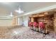Finished basement features a retro bar, carpeted floor, and ample space at 10731 Rosalie Dr, Northglenn, CO 80233