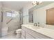 This updated bathroom has a glass door shower, vanity, and sink at 10731 Rosalie Dr, Northglenn, CO 80233