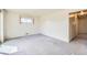 Bright bedroom with natural light from a window, featuring neutral walls and carpet at 10731 Rosalie Dr, Northglenn, CO 80233
