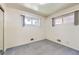 This carpeted bedroom has two windows at 10731 Rosalie Dr, Northglenn, CO 80233