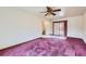 Cozy living room with a ceiling fan and sliding glass doors to the backyard at 10731 Rosalie Dr, Northglenn, CO 80233