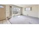 Bright living room with large windows, featuring neutral walls and flooring at 10731 Rosalie Dr, Northglenn, CO 80233