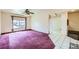 Open-concept living room featuring tile floors, and large windows for natural light at 10731 Rosalie Dr, Northglenn, CO 80233