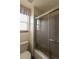 Bathroom featuring a shower, window, neutral colors, and a toilet at 116 Willowleaf Dr, Littleton, CO 80127