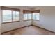 Bedroom with views from three windows at 116 Willowleaf Dr, Littleton, CO 80127