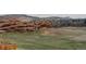 Scenic view of red rock formations and lush green space near residential area at 116 Willowleaf Dr, Littleton, CO 80127
