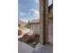 Close up of a brick entry way with a view of the surrounding neighborhood at 116 Willowleaf Dr, Littleton, CO 80127