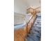 Foyer with hardwood floors, staircase, and views into the living room and dining room at 116 Willowleaf Dr, Littleton, CO 80127