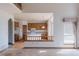 Open concept kitchen showcasing wood cabinets, central island and view to the Gathering room at 116 Willowleaf Dr, Littleton, CO 80127