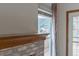 Brick fireplace in the living room with views to the backyard at 116 Willowleaf Dr, Littleton, CO 80127