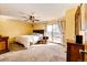 Comfortable bedroom with carpet floor, ceiling fan, closet, and natural light from the window at 13852 W 54Th Ave, Arvada, CO 80002