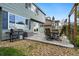 The backyard features a grill, patio seating, and well-maintained landscaping with a stone patio area at 1474 E Weldona Way, Superior, CO 80027