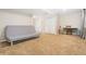 This carpeted basement features a futon and a desk with ample space at 1474 E Weldona Way, Superior, CO 80027