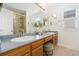 This bright bathroom features a double vanity and a separate shower room for ample space at 1474 E Weldona Way, Superior, CO 80027