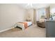 Cozy bedroom featuring natural light, a plush chair, and light-colored walls at 1474 E Weldona Way, Superior, CO 80027
