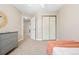 This cozy bedroom features neutral walls, a ceiling fan, a closet with sliding doors, and a stylish dresser at 1474 E Weldona Way, Superior, CO 80027