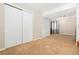 This spacious bonus room features a carpeted floor and multiple closets for ample storage at 1474 E Weldona Way, Superior, CO 80027