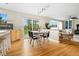 Bright dining area with access to backyard patio and connected to living area with a fireplace at 1474 E Weldona Way, Superior, CO 80027