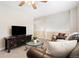 This inviting living room is furnished with stylish pieces and has a view of the staircase at 1474 E Weldona Way, Superior, CO 80027