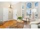 Bright living room featuring high ceilings, a large arched window and hardwood floors at 1474 E Weldona Way, Superior, CO 80027