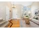 Bright living room featuring high ceilings, a large arched window and hardwood floors at 1474 E Weldona Way, Superior, CO 80027