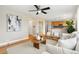 Open concept living area with hardwood floors and seamless flow to the kitchen at 1474 E Weldona Way, Superior, CO 80027