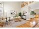 Bright living room featuring high ceilings, a large window, and an open concept design at 1474 E Weldona Way, Superior, CO 80027