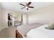 This neutral main bedroom has a ceiling fan and attached bathroom with an adjacent walk-in closet at 1474 E Weldona Way, Superior, CO 80027