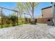 The backyard boasts a spacious stamped concrete patio, mature trees, and cozy outdoor seating at 1474 E Weldona Way, Superior, CO 80027