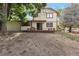 Two-story home's backyard, showing the deck and tree-filled, partially-graded yard at 5138 S Sedalia Ct, Centennial, CO 80015