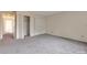 Bedroom with neutral carpet featuring a large closet with bi-fold doors at 5138 S Sedalia Ct, Centennial, CO 80015