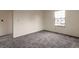 Bedroom featuring neutral colored carpet and one window for ample lighting at 5138 S Sedalia Ct, Centennial, CO 80015