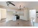 Kitchen featuring white cabinets, stainless steel appliances, and pendant lighting at 5138 S Sedalia Ct, Centennial, CO 80015