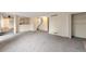 Large open-concept living space with plush carpet and access to the kitchen and staircase at 5138 S Sedalia Ct, Centennial, CO 80015