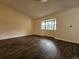 Bright living room with wood floors and a large bay window offering natural light at 5138 S Sedalia Ct, Centennial, CO 80015