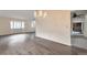 Spacious living room featuring hardwood floors, a chandelier, and ample natural light at 5138 S Sedalia Ct, Centennial, CO 80015