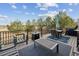Relaxing back deck features outdoor seating, a grill, and beautiful views for entertaining at 11594 Yellow Daisy Dr, Parker, CO 80134