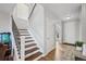 Bright entryway with hardwood floors, staircase, and natural light from the large window at 11594 Yellow Daisy Dr, Parker, CO 80134