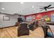 Relaxing living room with leather recliners, wood accent wall, and hardwood floors at 11594 Yellow Daisy Dr, Parker, CO 80134