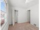 Bright bedroom featuring neutral carpet, white walls, and closet at 3245 S Elati St, Englewood, CO 80110