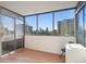 Enclosed balcony area with floor to ceiling windows boasting city views and access to fresh air at 740 N Pearl St # 606, Denver, CO 80203