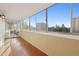 Enclosed balcony features large windows with views of the city and sky at 740 N Pearl St # 606, Denver, CO 80203