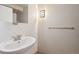 Bright bathroom featuring a pedestal sink, updated lighting fixture, and towel bar at 740 N Pearl St # 606, Denver, CO 80203