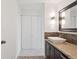 Bathroom vanity with a stone countertop, modern sink, and a large storage closet at 740 N Pearl St # 606, Denver, CO 80203