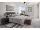 Bright bedroom featuring a large window, neutral decor, and comfortable furnishings at 740 N Pearl St # 606, Denver, CO 80203