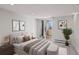 Bright bedroom featuring a walk-out balcony, neutral decor, and comfortable furnishings at 740 N Pearl St # 606, Denver, CO 80203