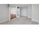 Carpeted bedroom with double doors leading to another room with hardwood floors at 740 N Pearl St # 606, Denver, CO 80203